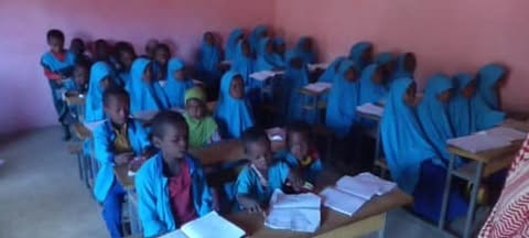 Students in classroom uniforms
